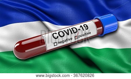 Flag of Lesotho waving in the wind with a positive Covid-19 blood test tube. 3D illustration concept for blood testing for diagnosis of the new Corona virus.