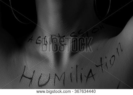 Part Of The Naked Body Of A Young Girl With The Inscription Humiliation . The Captions Are Written I