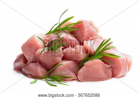Raw Chicken  Breast Fillet Chunks With Tarragon Herb Isolated On White