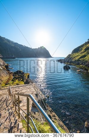 Bathing Place In The Town Of Pasajes San Juan Near San Sebastian. Gipuzkoa, Basque Country. Vertical