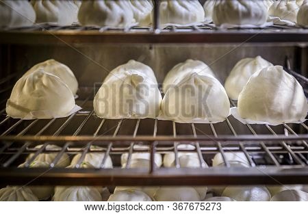 Freshly Baked Traditional Chinese Bao Buns On A Rack On Display At A Stall In Lau Pa Sat, Telok Ayer