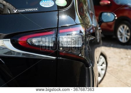 Novosibirsk/ Russia - May 03 2020:  Toyota Sienta, Glowing Taillight Of A Modern Car Close-up