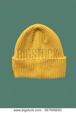 Yellow Winter Hipster Hat Pattern Isolated On Green Background. Fashion Casual Winter Hat. Winter Wo