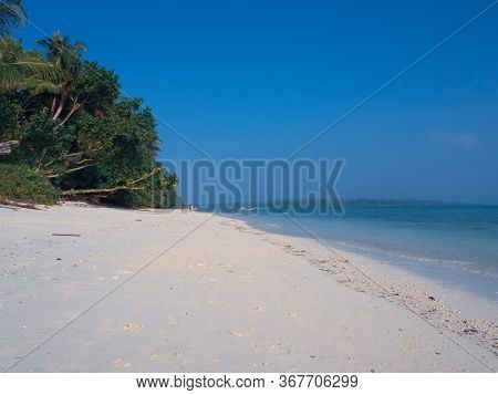 White Sandy Govind Nagar Beach In The Andaman Islands, India Under A Clear Blue Sky