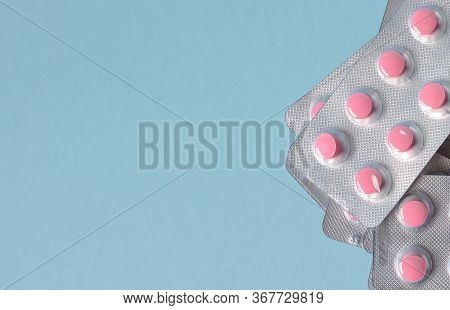 Pills Pink In A Pack On A Blue Background