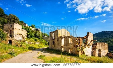 Ruined Buildings Of An Abandoned City. Architecture Of A Ghost Town.
