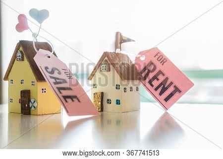 Home For Sale And Real Estate Mortgage Concept: Diy Little House Model With Tag Paper 