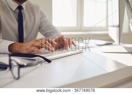 Work Online. Busy Faceless Worker Is Typing At Workplace Using Computer In Office.