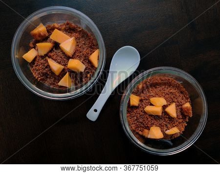Indian Panjeeri Pudding Is A Dessert Made With Sweet Flour Pudding With Mango And Milk Served In Gla