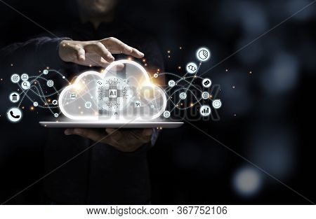 Businessman Holding Tablet With Artificial Intelligence Virtual Cloud Computing And Business Icon. C