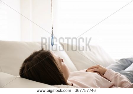 Patient On Sofa During Hypnotherapy Session In Office