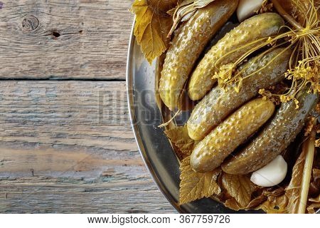 Homemade Pickled Cucumbers In Brine With Garlic, Dill And Horseradish. Wooden Background , Copy Spac