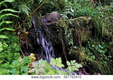 Small Waterfall Spotted In A Park In La Bresse, France