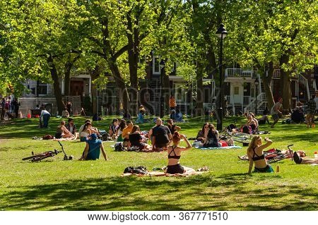 Montreal, Ca - 23 May 2020 : People Gathering During Coronavirus Pandemic In Laurier Park