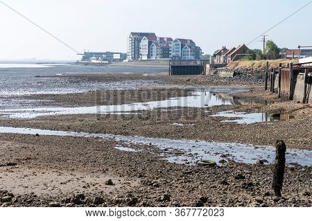 Coastline In Zeeuwse Village Yerseke With Famous Oysters Wells During Low Tide, Zeeland, Netherlands