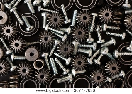 Mechanical Components On Black Background. Industrial Objects