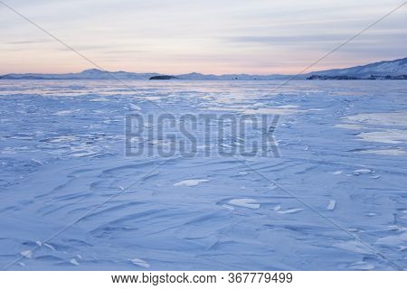 Lake Baikal, Winter. Cape Uyuga Sunset Landscape. Wavy Snow