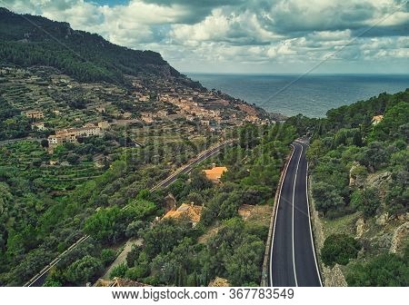 Aerial Photography Drone Point Of View Empty Waving Asphalt Road Through Lush Trees Small Village Of