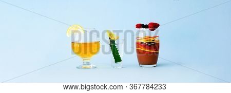 Quarantini Or Homemade Alcohol Drink With Wild Berries On Blue Background. The Concept Of New Popula