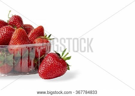 Heap Of Vivid Raw Tasty Saturated Ripe Red Strawberries Laying In Big Plastic Transparent Container 