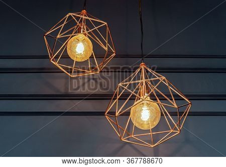 Light Bulbs With Copper Plafonds In Vintage Style. Edison's Lamps In The Loft Interior.