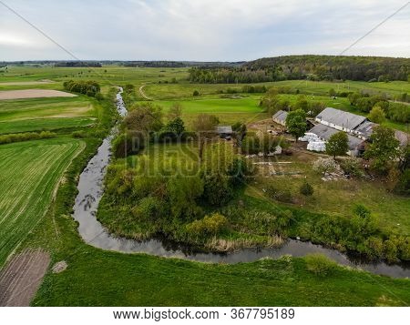Aerial View Of Krazante River And Farm Buildings In Kraziai, Samogetia, Lithuania
