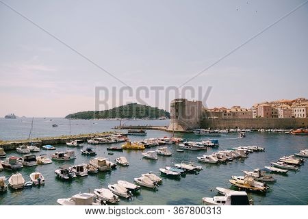 The Old Port Harbor Is Porporela, Near The Walls Of The Old Town Of Dubrovnik, Croatia. Moored Boats