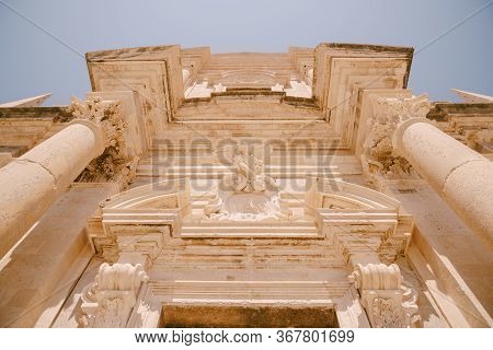 Facade Of The Church Of Saint Ignatius In Dubrovnik, Croatia. Statue Of An Angel Above The Entrance 