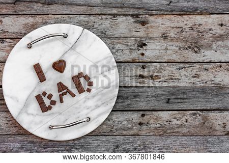 Celebrating Fathers Day Or Birthday. I Love Dad Laid Out In Chocolate Letters On A Marble Tray On A 