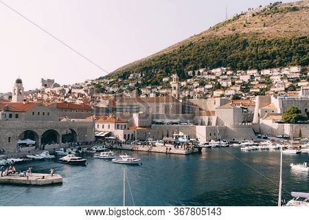 Dubrovnik, Croatia - 04 May 2016: The Old Port Harbor Is Porporela, Near The Walls Of The Old Town O