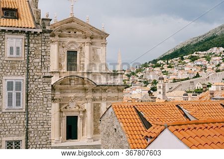 Facade Of The Church Of Saint Ignatius In Dubrovnik, Croatia. Statue Of An Angel Above The Entrance 