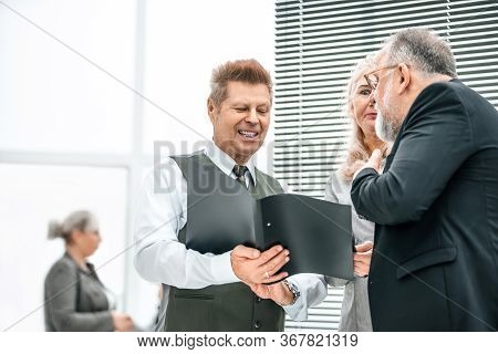 Close Up. Experienced Company Employees Discussing Business Documents