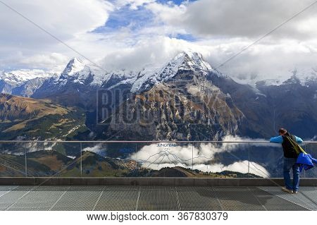 Lauterbrunnen, Switzerland - October 2019: A Tourist At The Viewpoint Deck Located At Birg Cableway 