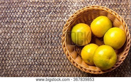 Orange In The Basket On A Beautiful Background.