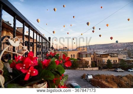 Cappadocia, Turkey - December 20, 2019: Hot Air Balloons Flying In Blue Sky With White Clouds Over H