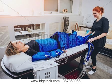 Pressotherapy Machine On Woman In Beauty Center
