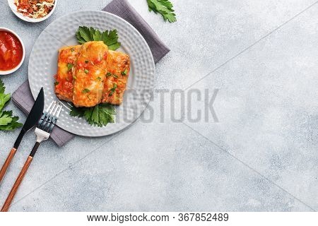 Cabbage Rolls With Beef, Rice And Vegetables On The Plate. Stuffed Cabbage Leaves With Meat. Gray Co