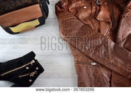 Fashion And Blogger Flatly On A Light Wood Background. Top View Women Clothes, Footwear, Accessories