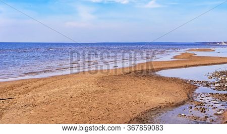 Seascape. Sandy Beach On The Sea On A Sunny Day With Beautiful Clouds.