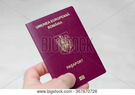 Close Up View Of A Romanian Passport On A White Background . Documents Required To Travel To Countri