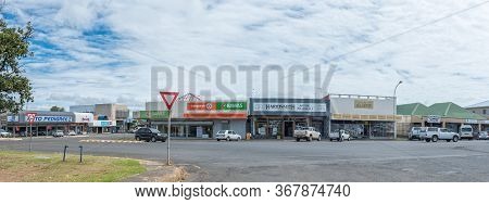 Harrismith, South Africa - March 16, 2020:  A Panoramic Street Scene, With Businesses, Vehicles And 
