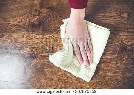 Young Woman Claning Brown And Wooden Desk