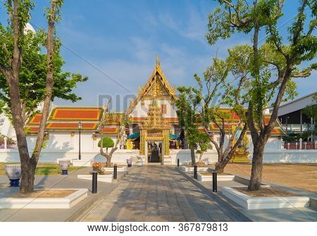 Wat Rakhang Khositaram, A Buddhist Temple Stupa At Noon With Blue Sky In Bangkok City, Thailand. Tha