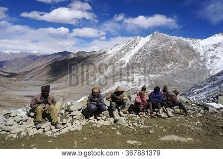 Daily Wages Workers Waiting For Transportation Near Khardungla Pass At 18,000 Feet, Leh Ladakh City,