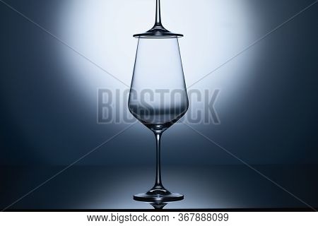 Empty Wine Glasses On A Blue Clean Gradient Background. Empty Drinking Transparent Wine Glasses