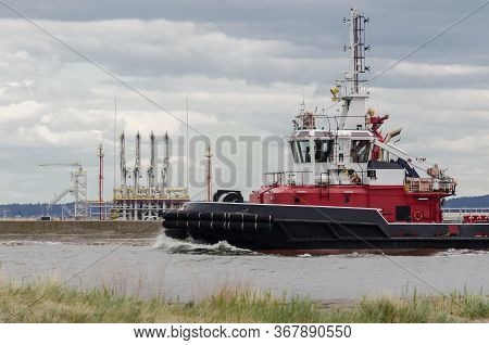 Maritime Trasnport - Fireboat In The Port Chanel On Background Of Lng Terminal