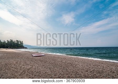 Two Singke Kayak On Shore Of Superior Lake, Canada