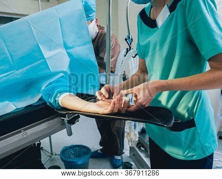 Pulse Oximeter On The Patients Hand. Surgery Equipment.