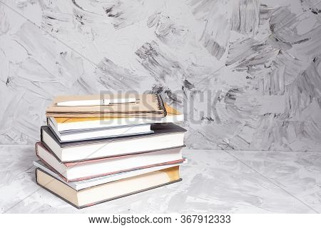 Stack Of Colorful Books. An Open Book On A Stack Of Books. The Concept Of Education, International B