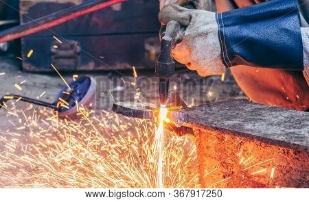 Close Up Hand Heavy Industrial Worker Is Working On Metal Work Factory Process By Cutting Sheet Stee